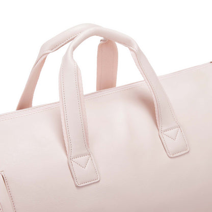 Närbild på handtag i PU-läder, rosa